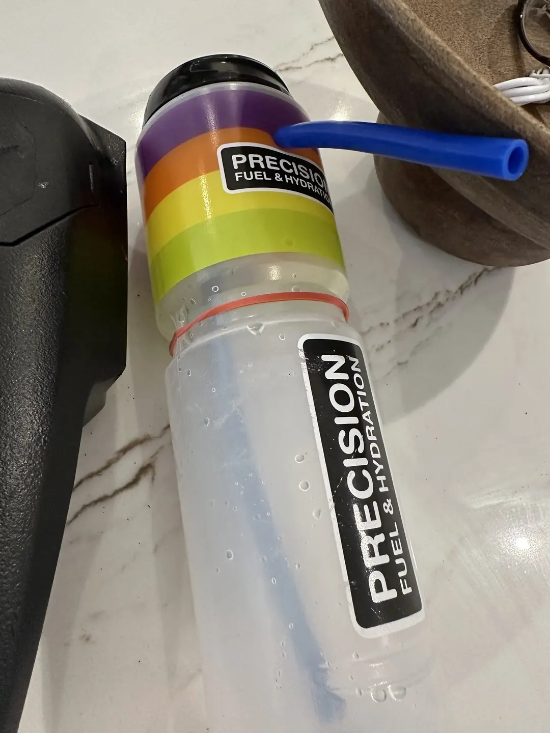 The home-made version: a sports bottle with a tube through the shoulder and a rubber band